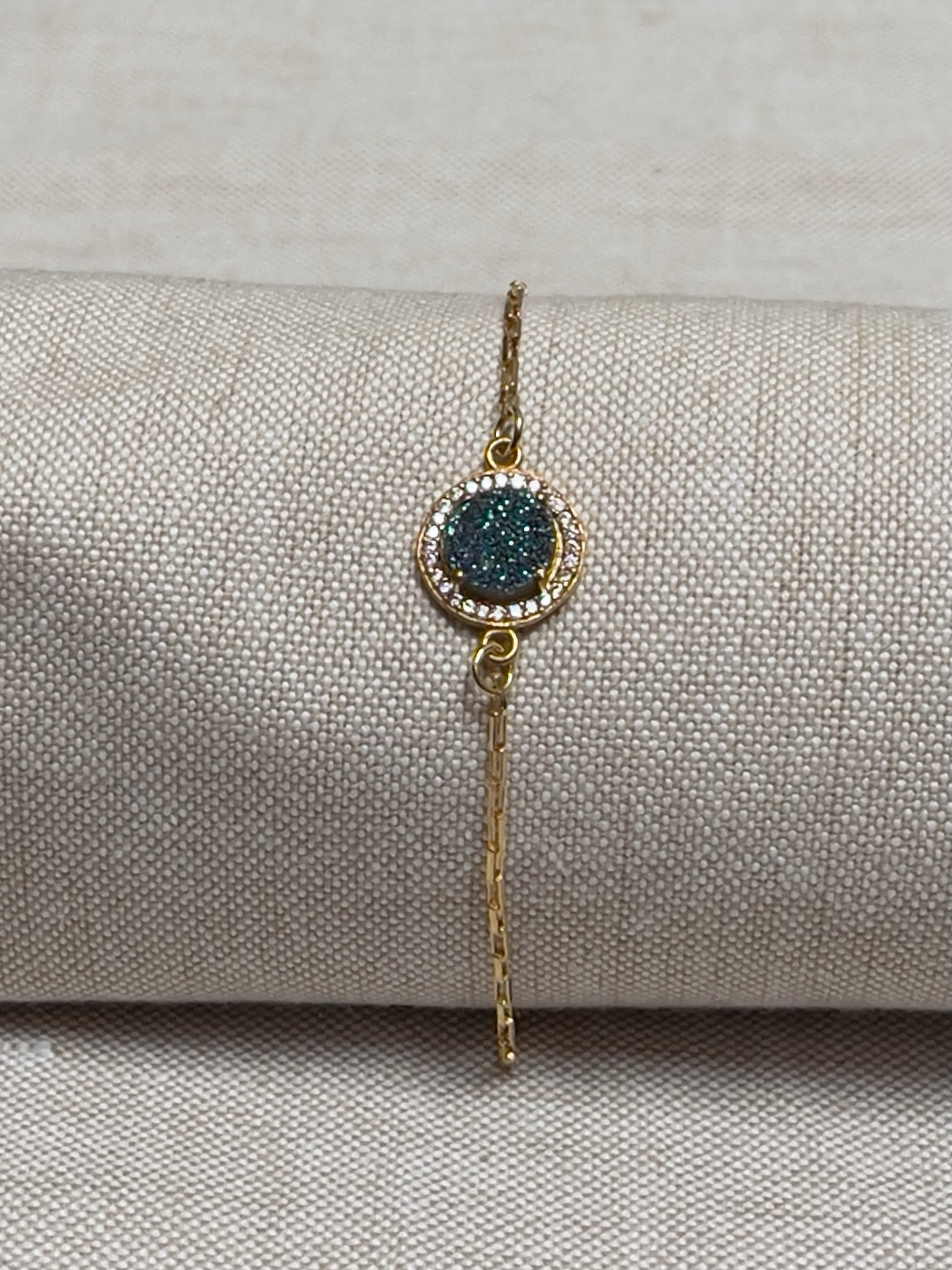 Image of bracelet. Chain Type: Elongated venetian Chain Thickness: 1.2 mm Clasp: Lobster  Chain: 12k Gold-filled Charm: Blue green druzy made of gold vermeil with CZ micro-pave