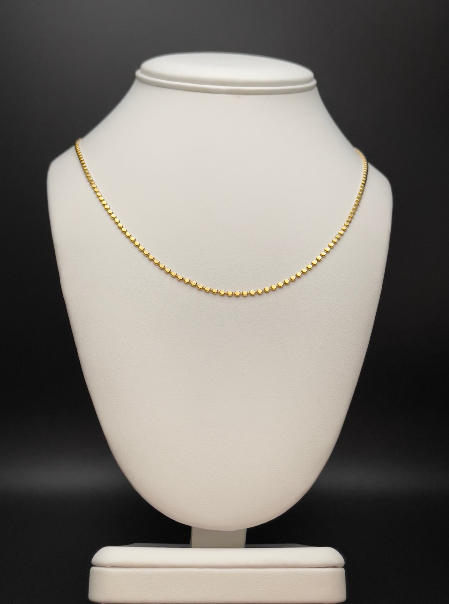Image of necklace. Chain Length: 18 inches Chain Type: flat bead Chain Thickness: 2 mm Clasp: Lobster Chain: 18k Gold-filled 
