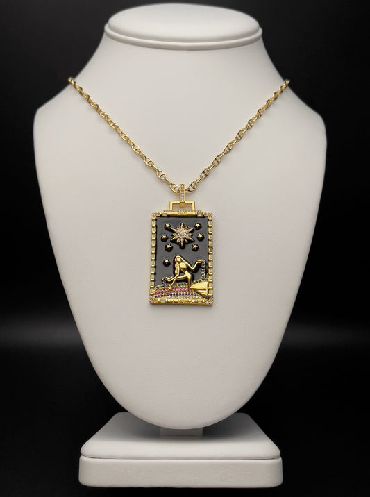 Image of necklace. Chain Length: 18 inches + 2 inch extension Chain Type: Mariner Chain Thickness: 3.2 mm Clasp: Lobster Charm: 44.5 X 25 mm  Chain: 14k Gold-plated Charm: 14k Gold-plated with black enamel