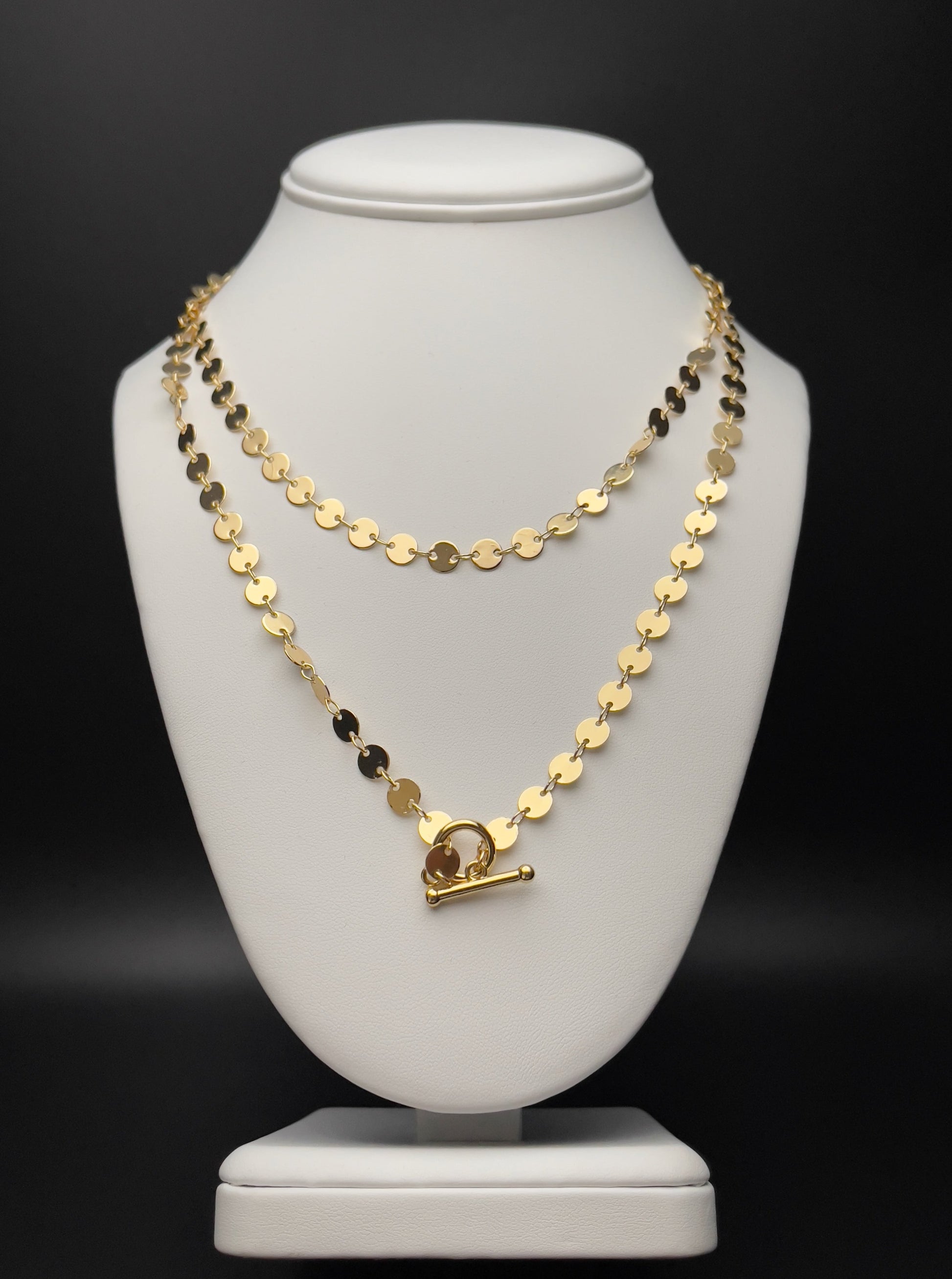 Image of necklace. Chain Length: 36 inches Chain Type: Polished disc Chain Thickness: 6 mm Clasp: Toggle  Chain: 14k Gold-plated